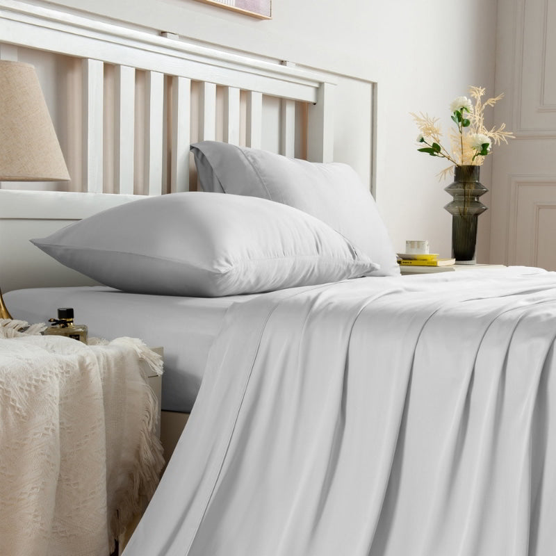 alt="Side view of light grey sheet sets produce a lustrous silky smooth fabric to your bedroom"