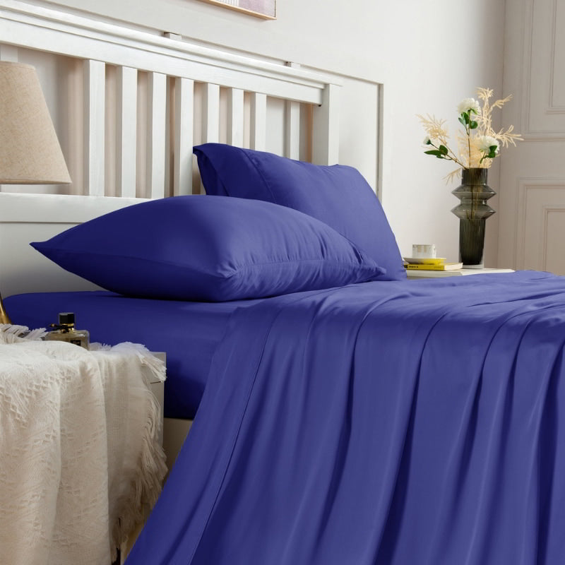 alt="Side view of navy sheet sets produce a lustrous silky smooth fabric to your bedroom"