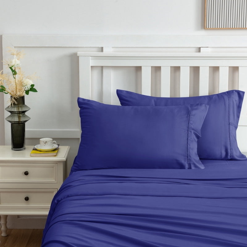 alt="Zoom in view of navy sheet set produces a lustrous silky smooth fabric to your bedroom"