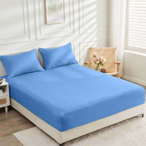 A light blue bed fitted sheet offers luxurious comfort with 2000 thread count to your cosy bedroom.