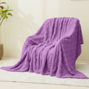 Detailed view of a cosy lavender blanket is perfect for a stylish and inviting bedroom atmosphere.