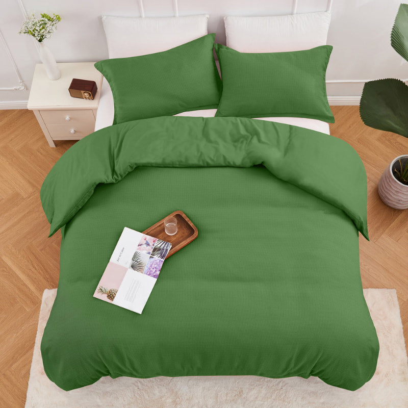 alt="Top view of a green quilt cover set featuring a cotton waffle weave design"