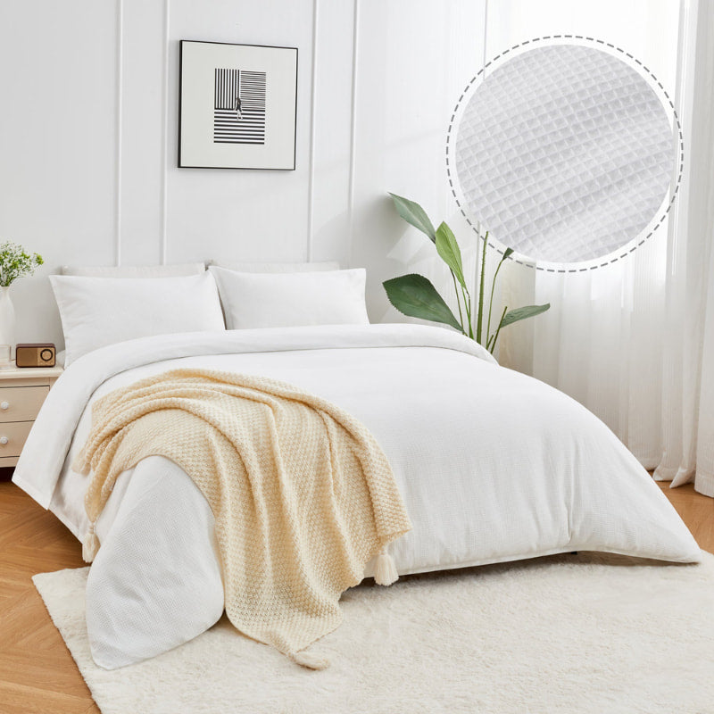 alt="A white quilt cover designed to provide comfort and style to your bedroom."