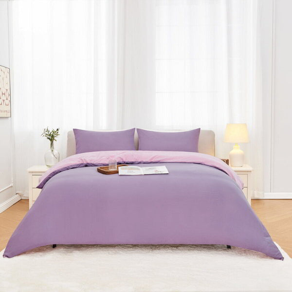 alt="Lilac Linenova quilt cover set neatly laid on a bed, showcasing its elegant and soft appearance."