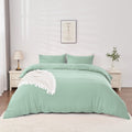 alt="Elegant sage green quilt cover set displayed on a bed, enhancing bedroom luxury and comfort"