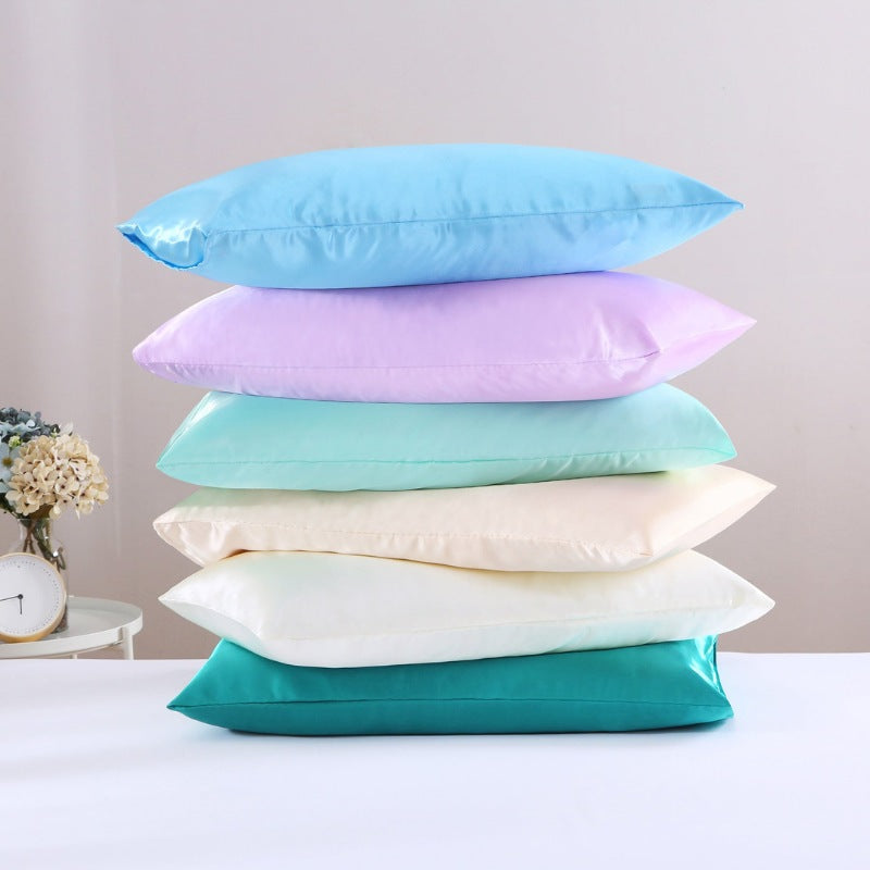 A stack of six colourful silky-smooth texture pillowcases that are luxurious, allergy-friendly, and promote healthy hair and skin.