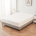 alt="A luxuriously soft 100% cotton white fitted sheet with deep pocket in a cosy bedroom"