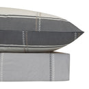 Close-up of Alfie quilt cover's colourful pattern and brushed texture