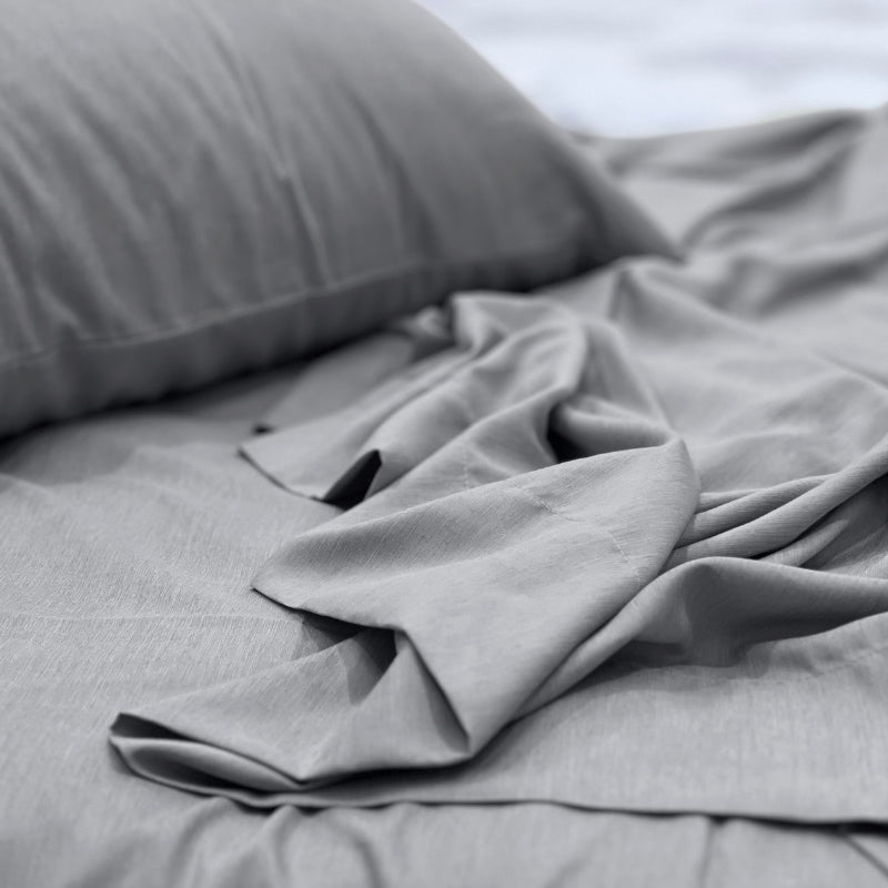 alt="A luxuriously soft to touch bamboo and microfibre blend sheet set in grey"