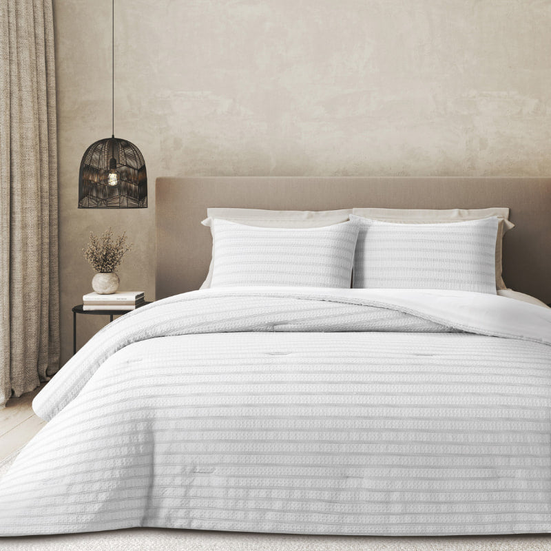 Close up look of Beliza Comforter Set features a soft waffle weave design in white, enhancing your bedroom's tranquil and welcoming ambiance.