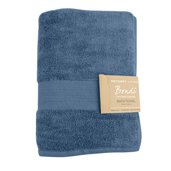 alt="A folded with tag details of blue haze bath towel featuring its high level of softness and premium luxurious cotton."