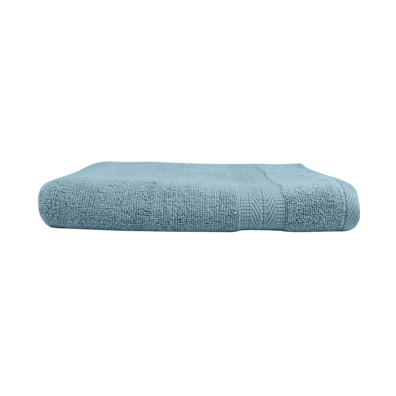 alt="An elegantly folded premium spa blue oasis hand towel, showcasing its minimal and soft details"