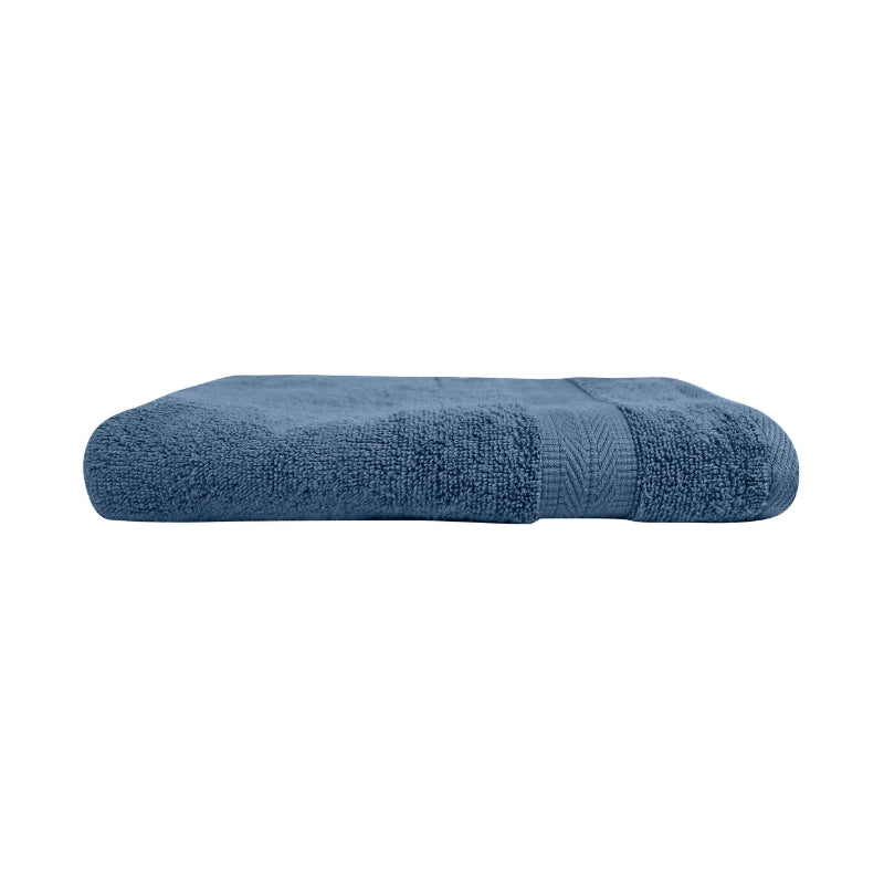 alt="An elegantly folded premium blue haze oasis hand towel, showcasing its minimal and soft details"