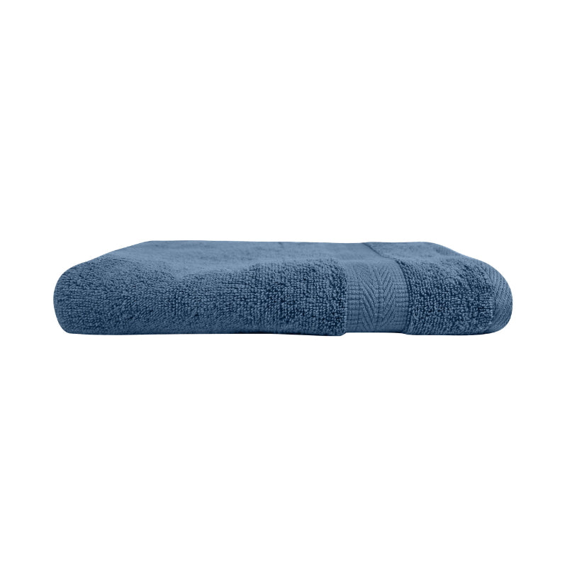 alt="An elegantly folded premium blue haze oasis hand towel, showcasing its minimal and soft details"