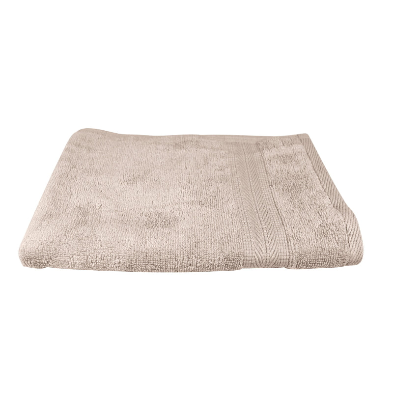alt="An elegantly folded premium beach colour hand towel, showcasing its minimal and soft details"