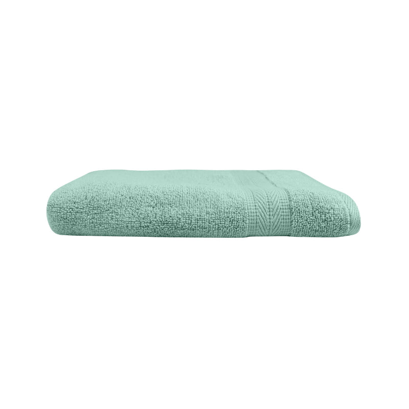 alt="An elegantly folded premium dusty sea colour hand towel, showcasing its minimal and soft details"