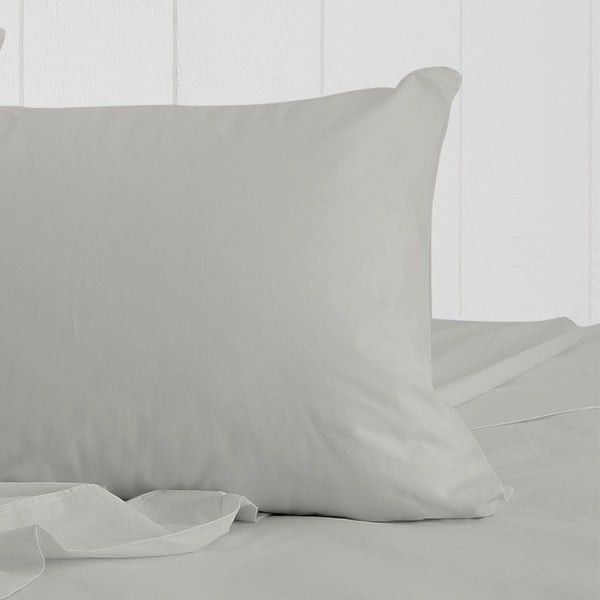 alt="The actual photo of a breath cotton standard pillowcase in pewter colour featuring its minimal, inviting softness and comfort" 