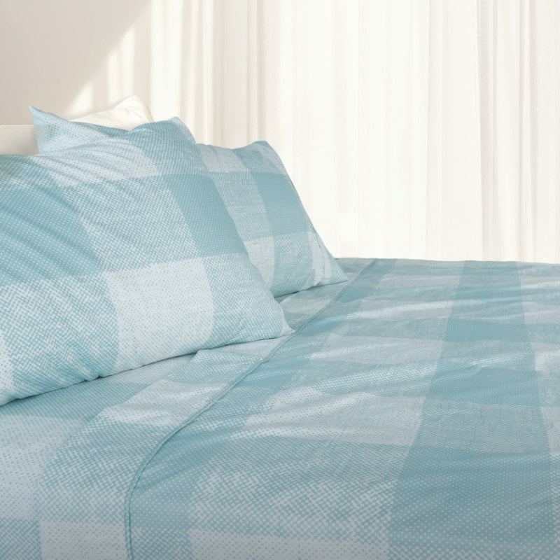 Cornwall Thermal Flannel Sky Quilt Cover Set styled on a bed with matching pillowcases