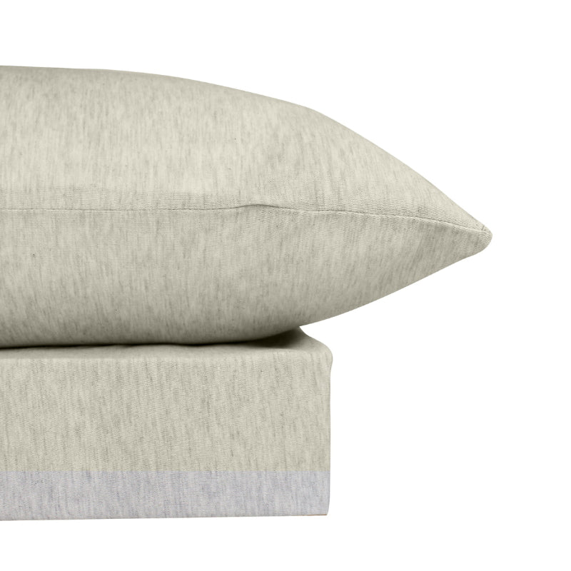 alt="Close-up look of an oatmeal coloured bamboo cotton sheet set featuring its inviting softness and comfort"