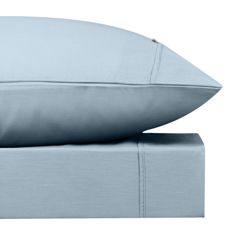 alt="Close-up look of a sky blue sheet set featuring its softness cotton and durability of polyester comfort for a restful night's sleep"