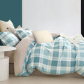 A cotton quilt cover set with a classic plaid design, offering comfort and style for a refreshing bedroom atmosphere.