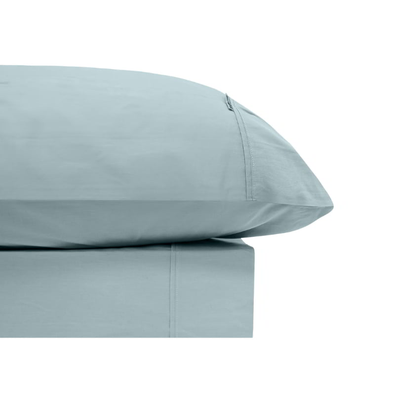 alt="Blue sheet set made from organic cotton and bamboo, showcasing inviting softness and cottony comfort"