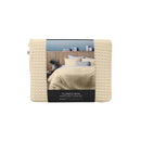 Front packaging details of a luxurious quilt cover set in a natural colour scheme featuring a modern texture.