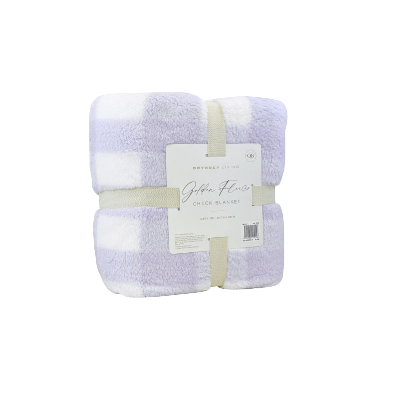 Side packaging details of a cosy bed with a lilac and white blanket featuring a large checkered pattern creates a bold visual grid, adding colour and pattern to the room's decor.