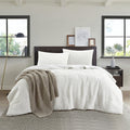 The Haleiwa quilt cover set showcases a textured palm leaf pattern, bringing a serene beach vibe to your sleeping space.