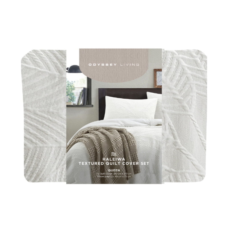 Packaging details of the Haleiwa quilt cover set showcases a textured palm leaf pattern, bringing a serene beach vibe to your sleeping space.