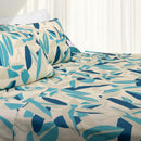 Made bed with Odyssey Living Thermal Flannel Isla Quilt Cover in abstract blue and aqua leaf print