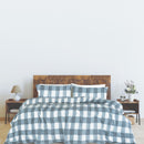 Bed styled with Odyssey Living Lawson Sherpa Check Storm Blue Quilt Cover and matching pillowcases