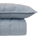 Close-up view of the quilted texture and stitching on the Storm Blue comforter with pillowcase