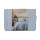 Folded Odyssey Living comforter set in packaging, showing the relaxed blue tone and product details
