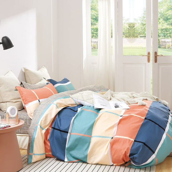 alt="Luxurious quilt cover set features a classic check design reinvented with on-trend hues"