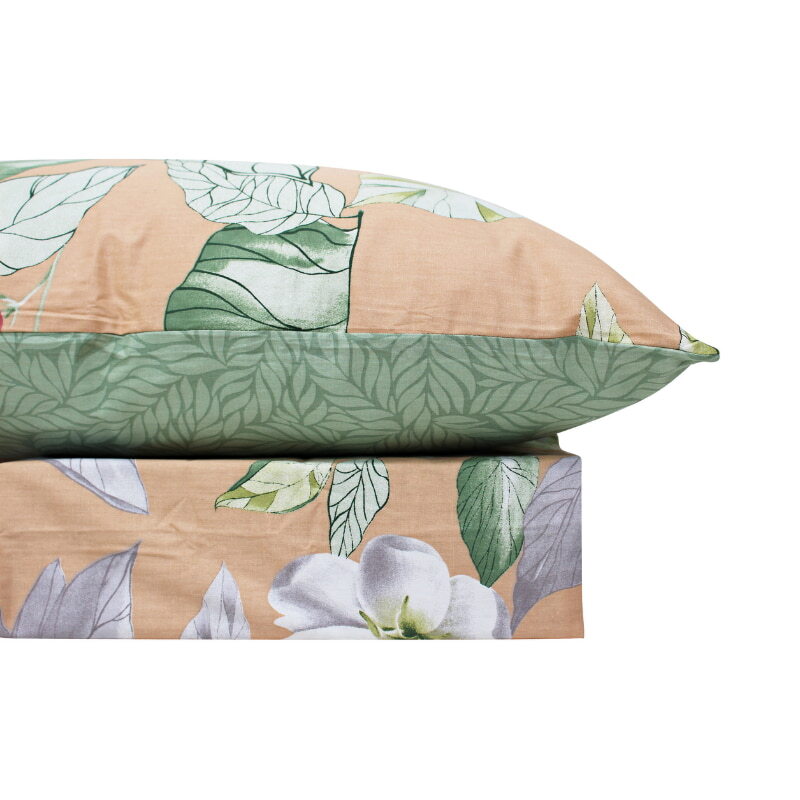 alt="Luxurious quilt cover set features lush flowers against a peach background along with the pillowcases"