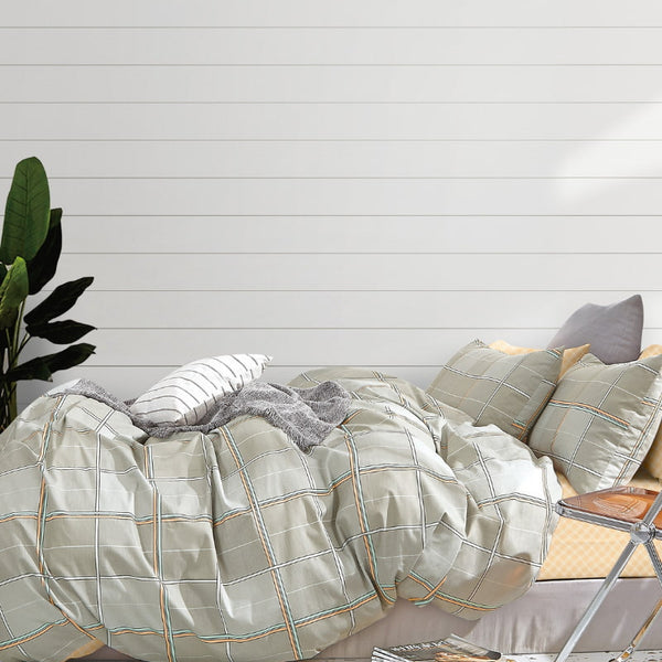 alt="Luxurious quilt cover set features a fresh stripe design and co-ordinating geometric reverse"