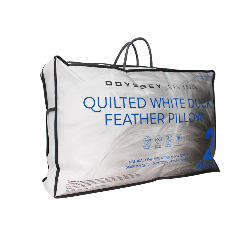 alt="Side details of a nice packaging of a white pillow features a soft feather and quilted design"
