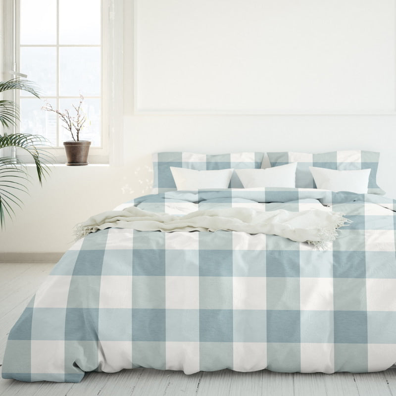 Close up view of the Salisbury Sunwashed Comforter Set brings casual elegance and comfort to your bedroom with a white bed and blue checkered design.