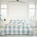 Salisbury Sunwashed Comforter Set brings casual elegance and comfort to your bedroom with a white bed and blue checkered design.