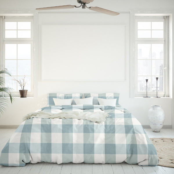Salisbury Sunwashed Comforter Set brings casual elegance and comfort to your bedroom with a white bed and blue checkered design.