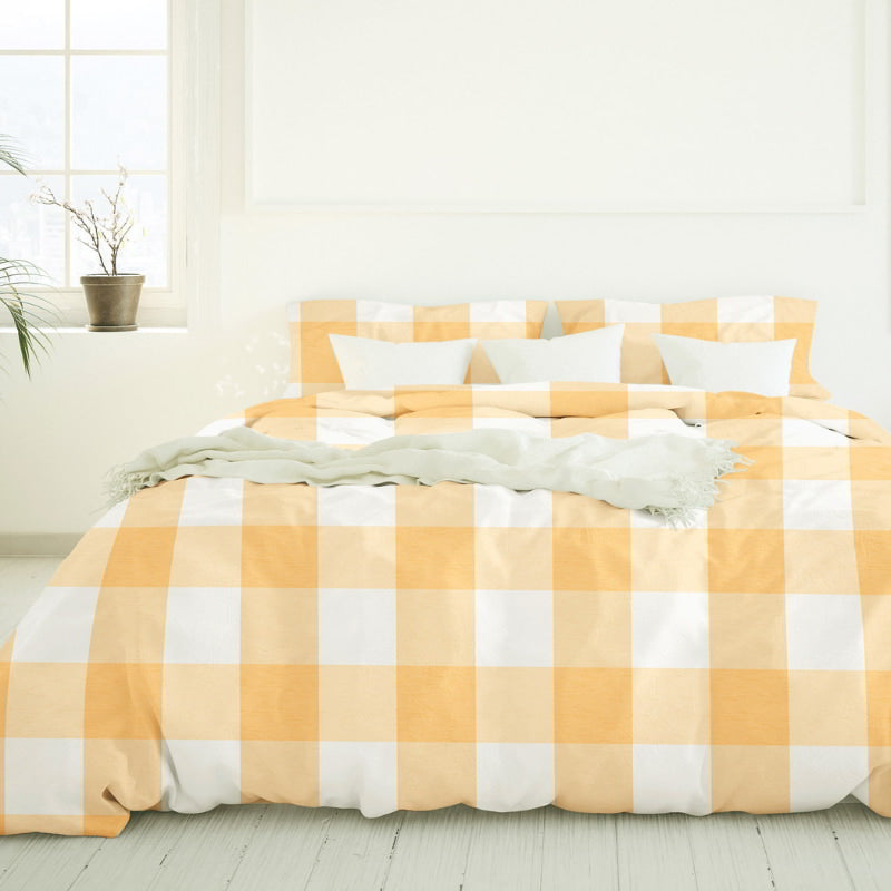 Close up view of a yellow and white checkered bedding, featuring a modern yet classic appeal and a calm finish of Salisbury Sunwashed Comforter Set for a cosy bedroom ambiance.