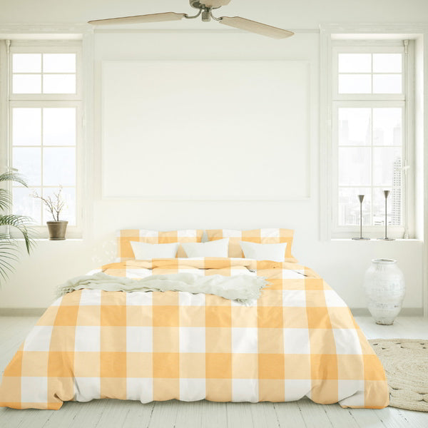 A yellow and white checkered bedding, featuring a modern yet classic appeal and a calm finish of Salisbury Sunwashed Comforter Set for a cosy bedroom ambiance.