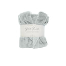 A front details of a neatly folded silver silk touch bathrobe, exuding luxurious elegance and comfort.