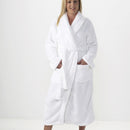 A picture of a girl exuding elegance in a white silk touch bathrobe, embodying luxury and comfort.