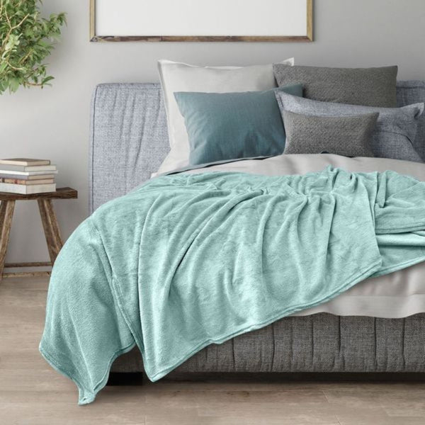 Transform your space into a cosy sanctuary with the blue Odyssey Living Super Soft Blanket, designed to complement your mood and décor with its harmonious colour scheme.