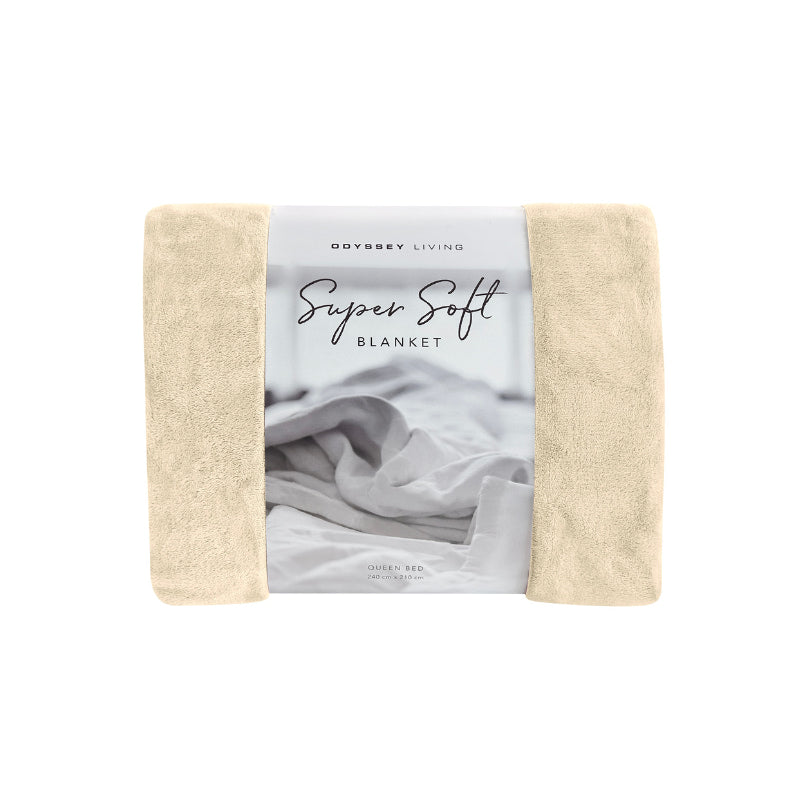 Front packaging details of the cream Odyssey Living Super Soft Blanket creating the perfect setting to cosy up in the luxurious comfort and warmth of the bed.