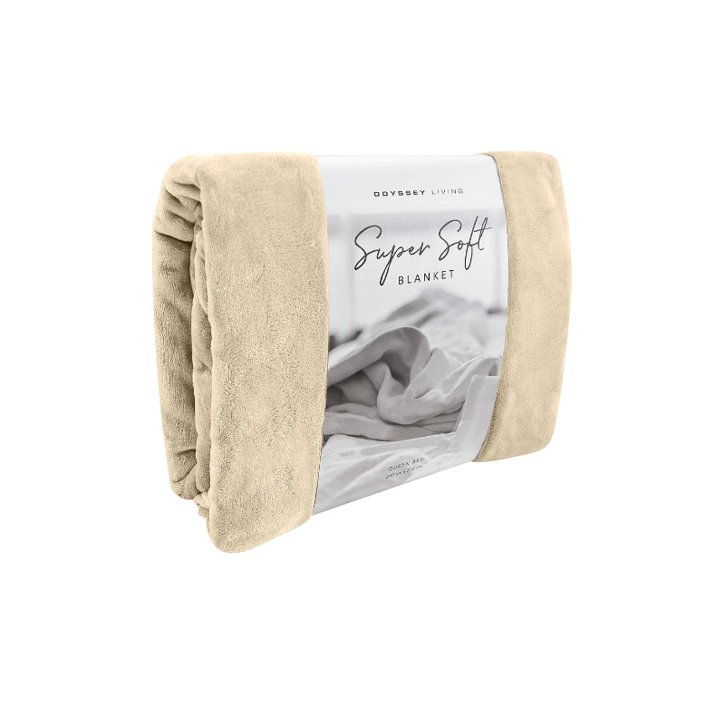 Side packaging details of the cream Odyssey Living Super Soft Blanket creating the perfect setting to cosy up in the luxurious comfort and warmth of the bed.