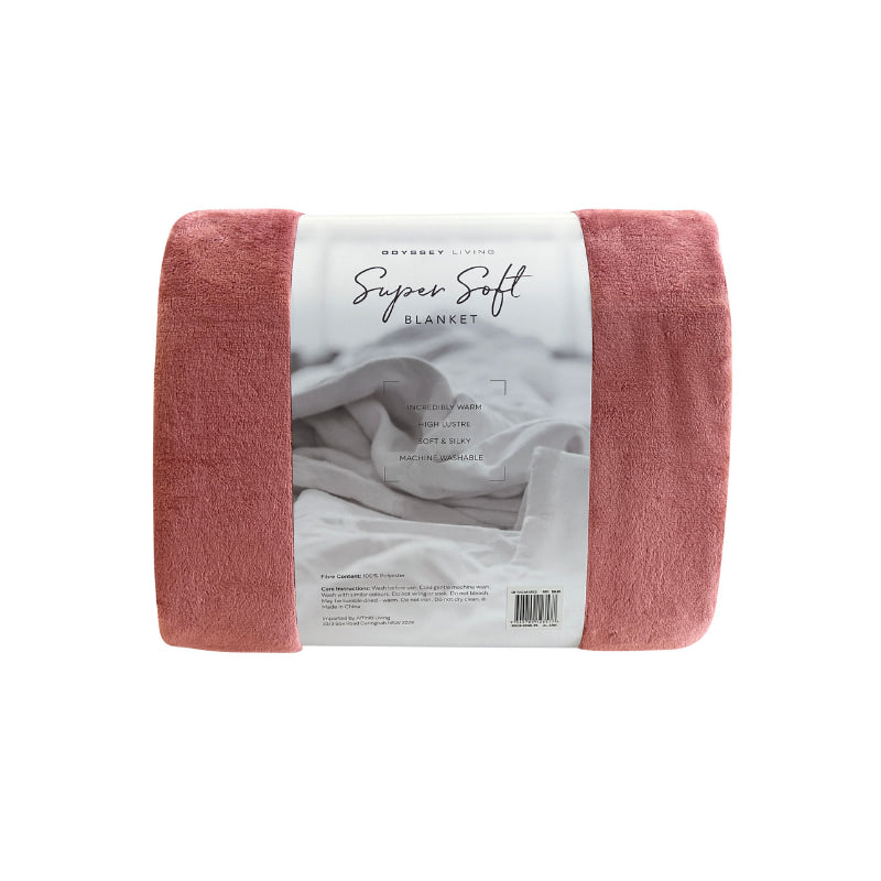 Back details of the red Odyssey Living Super Soft Blanket creating the perfect setting to cosy up in the luxurious comfort and warmth of the bed.