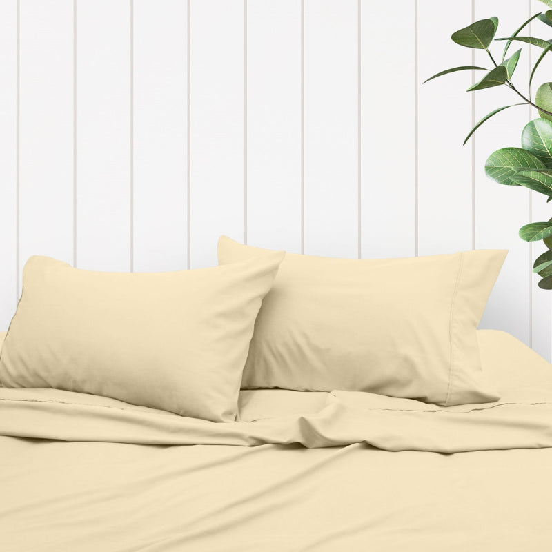 A clean and classic natural-toned bed with matching sheets and pillows, made of 100% microfibre for a soft and warm feel.